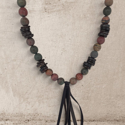Jasper stone and wood round beads necklace with a leather tassel on a long necklace
