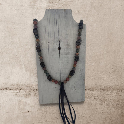 jasper round stone beads on a long necklace with a leather brown tassel
