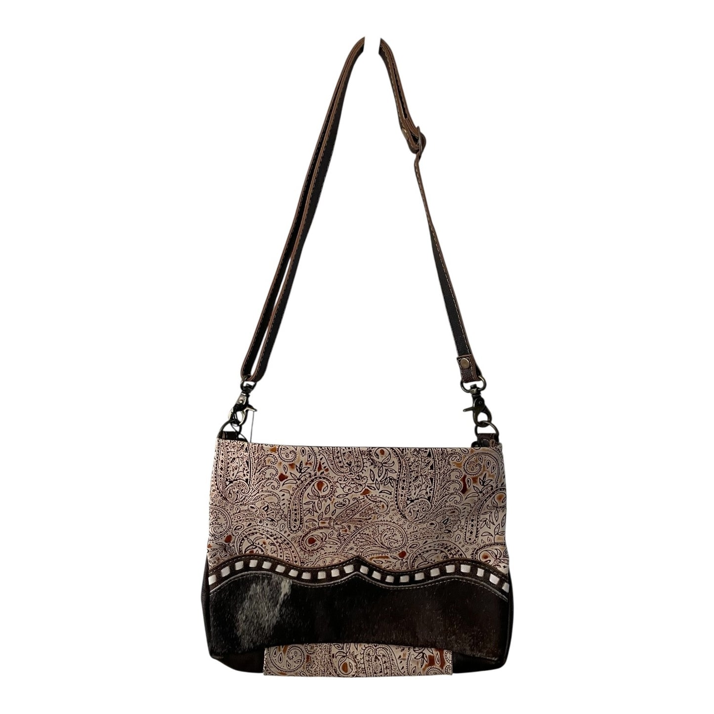 Handbag with patterned top and black bottom section on a white background