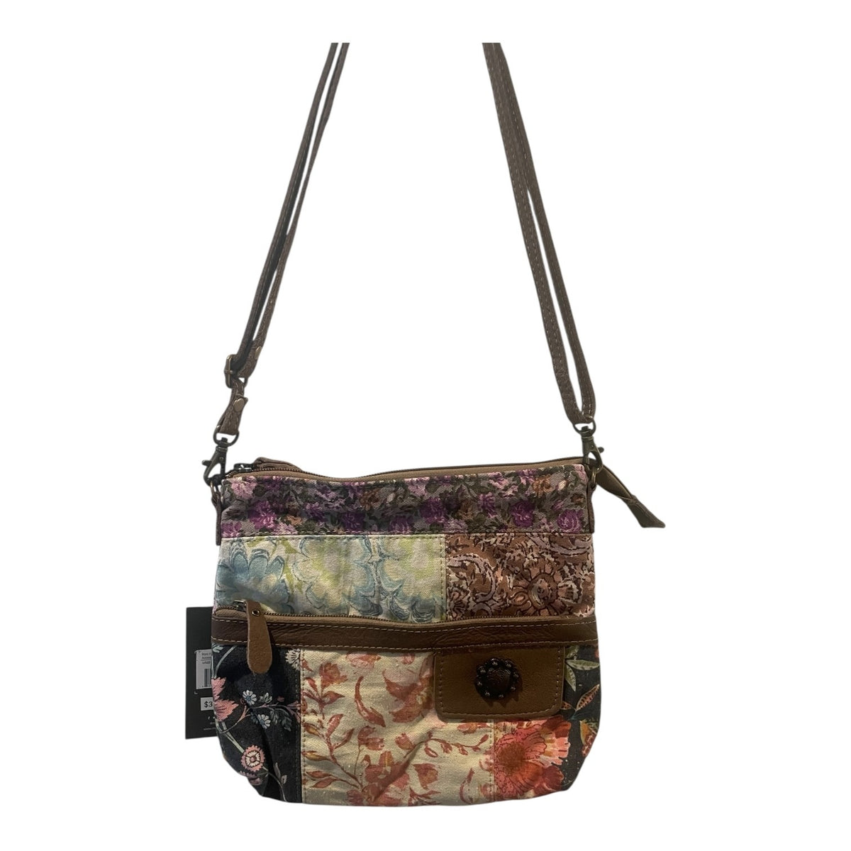 Multicolored patchwork handbag with floral patterns on a white background
