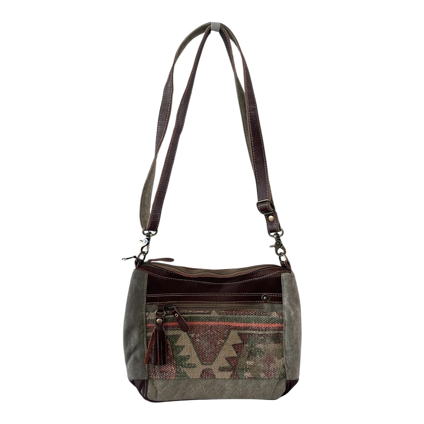 Handbag with patterned front pocket on a white background