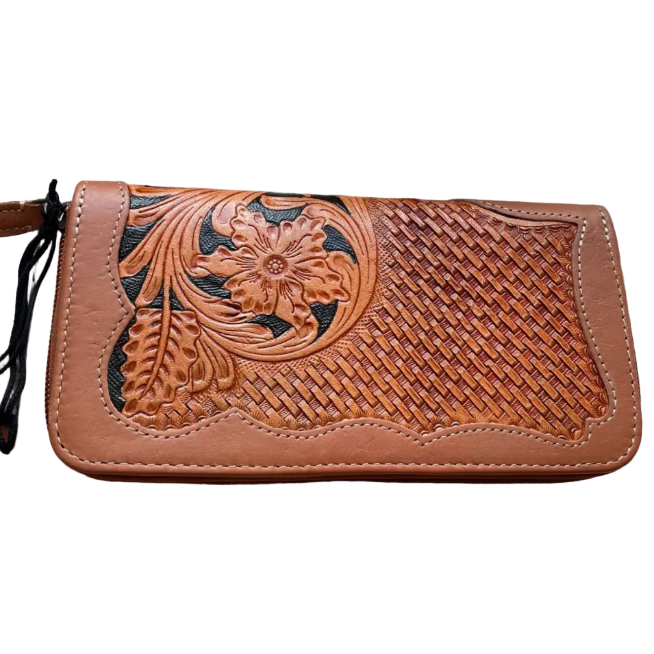 Brown leather wallet with floral embossing on a wooden surface