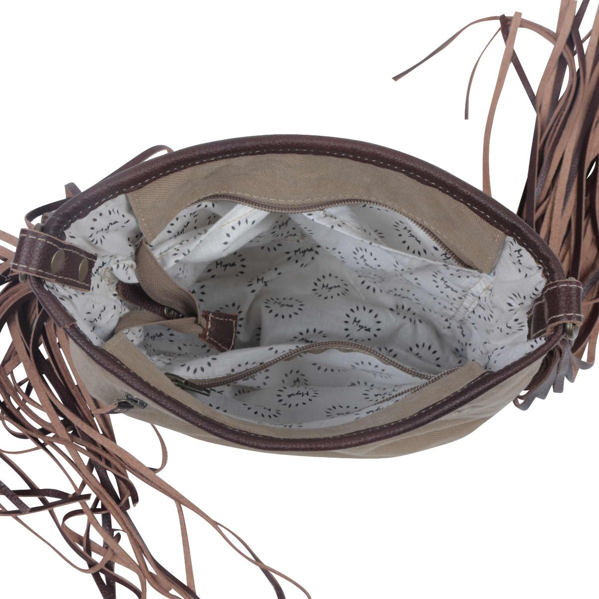 Close-up of a brown leather handbag with a patterned interior lining.