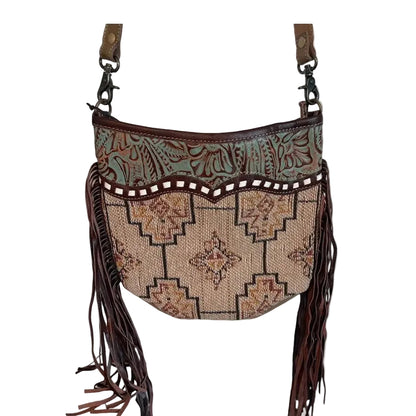 Decorative bag with tribal patterns and fringes on a white background