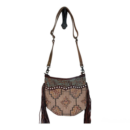 Patterned handbag with tassels on a white background