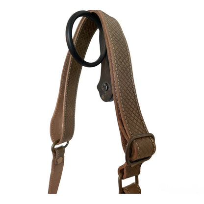 Brown leather strap with black ring on a white background