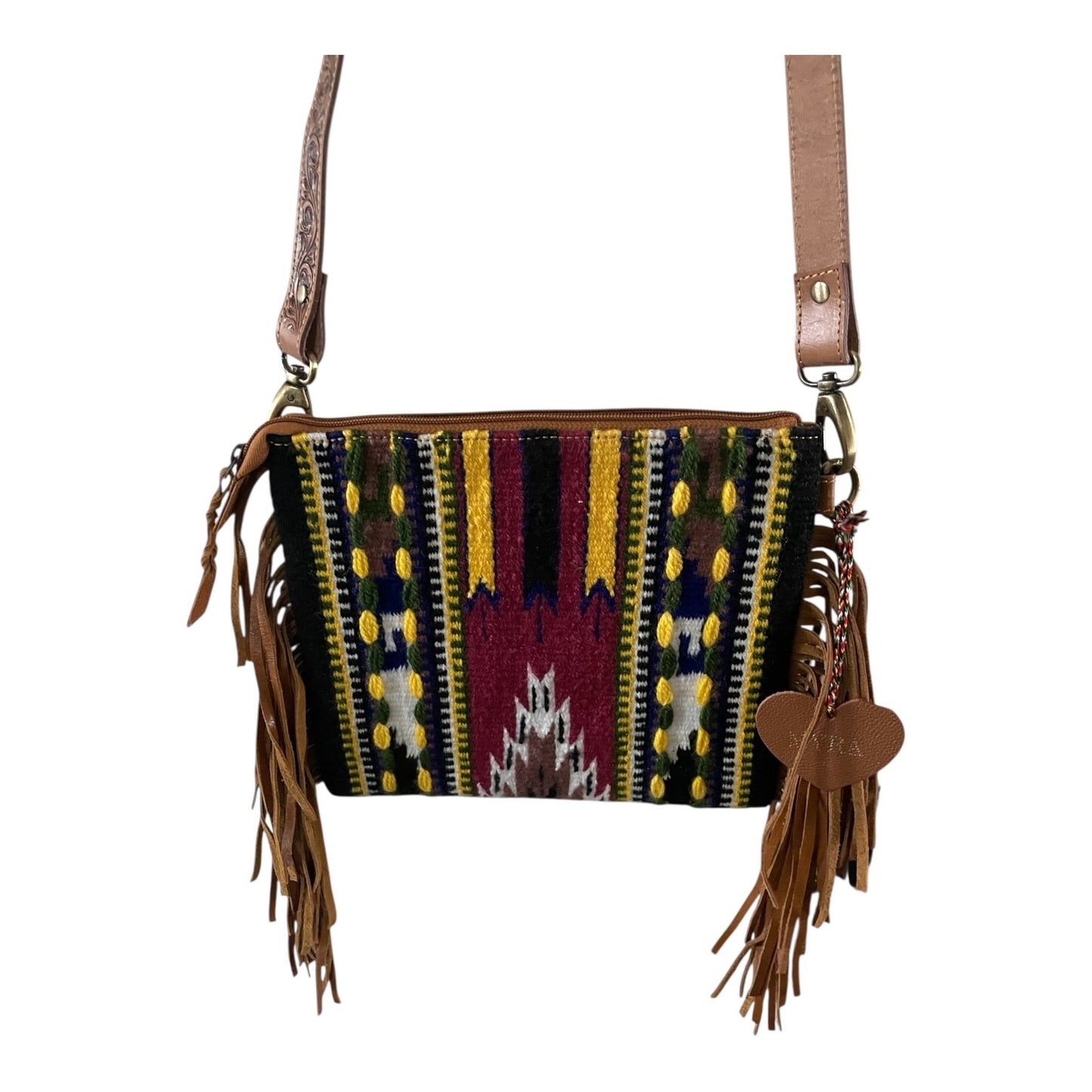 Multicolored patterned handbag with fringe details on a white background