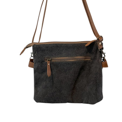 Dark gray shoulder bag with brown accents on a white background