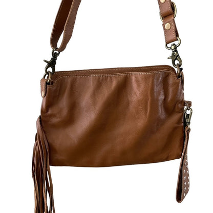 Brown leather handbag with fringes on a white background