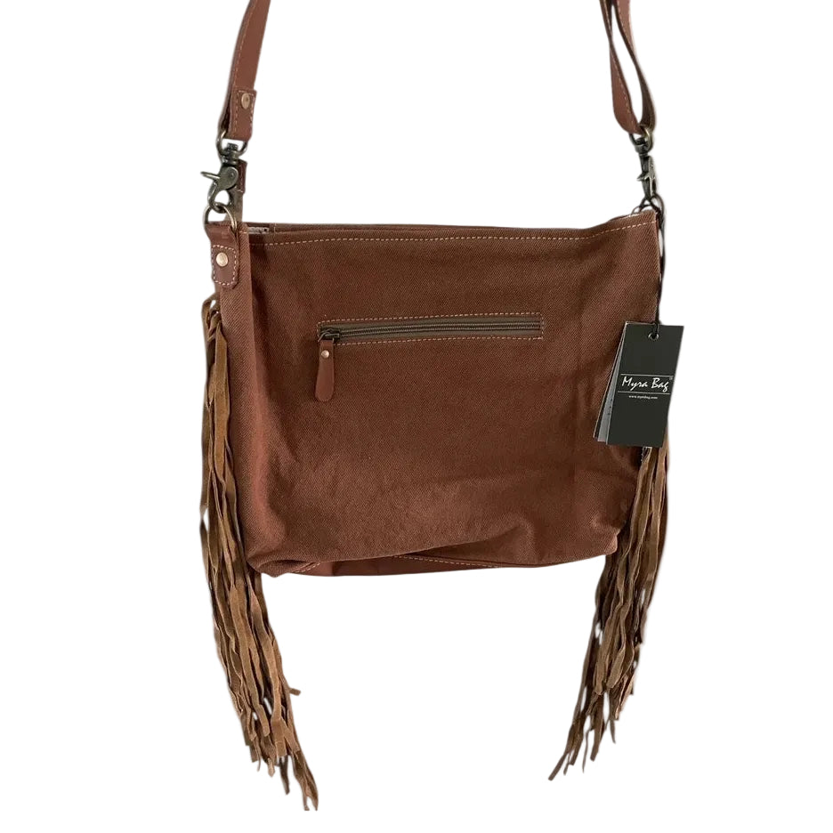 Brown leather handbag with fringe details and a visible brand tag on a white background