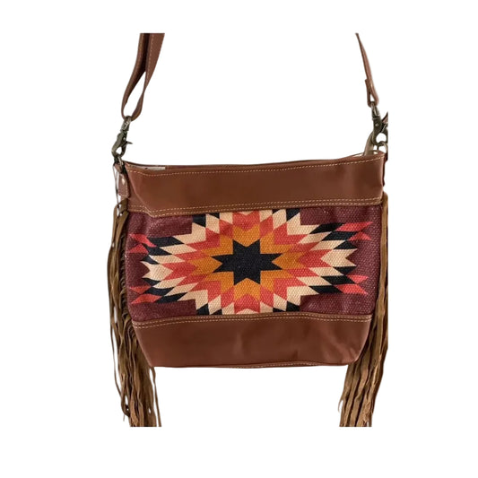 Brown leather handbag with a colorful geometric pattern on a white background