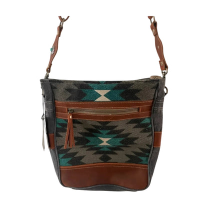 Handbag with geometric pattern and brown accents on a white background