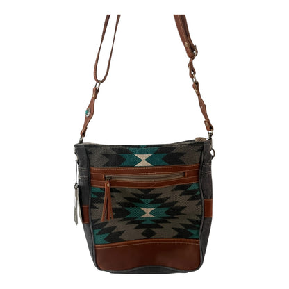 Patterned handbag with brown accents on a white background