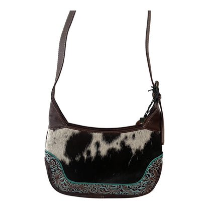 Brown and black patterned handbag with a strap on a white background