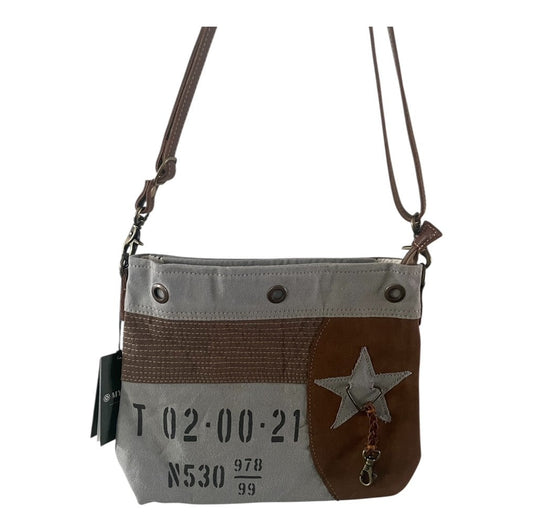 Gray and brown crossbody bag with star design on a white background