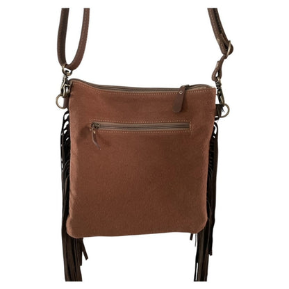 Brown leather crossbody bag with fringe on a white background