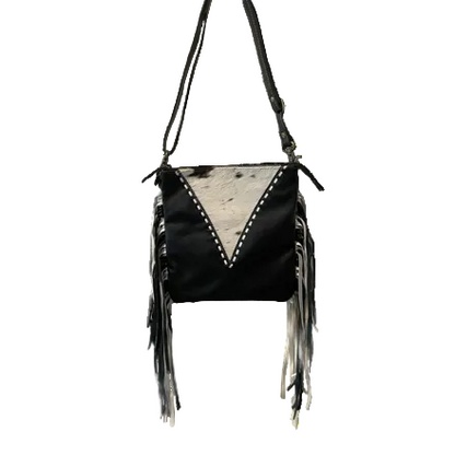 Black leather crossbody bag with fringe details on a white background