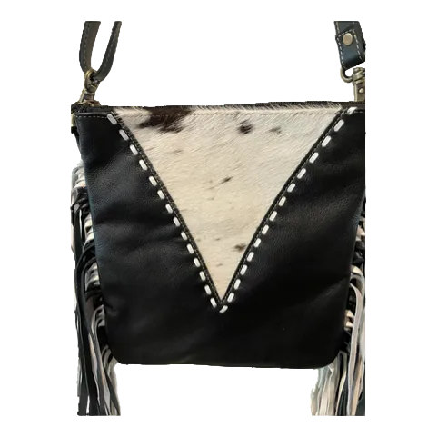 Black leather crossbody bag with cowhide pattern on a white background