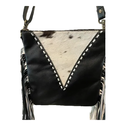 Black leather crossbody bag with cowhide pattern on a white background