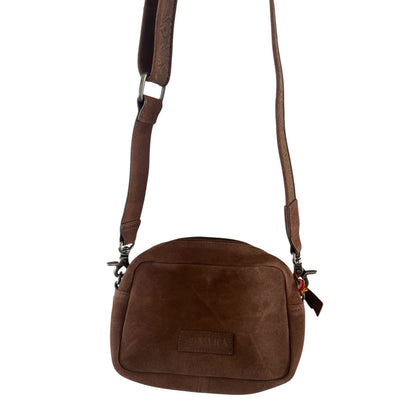 Brown leather crossbody bag on a white background