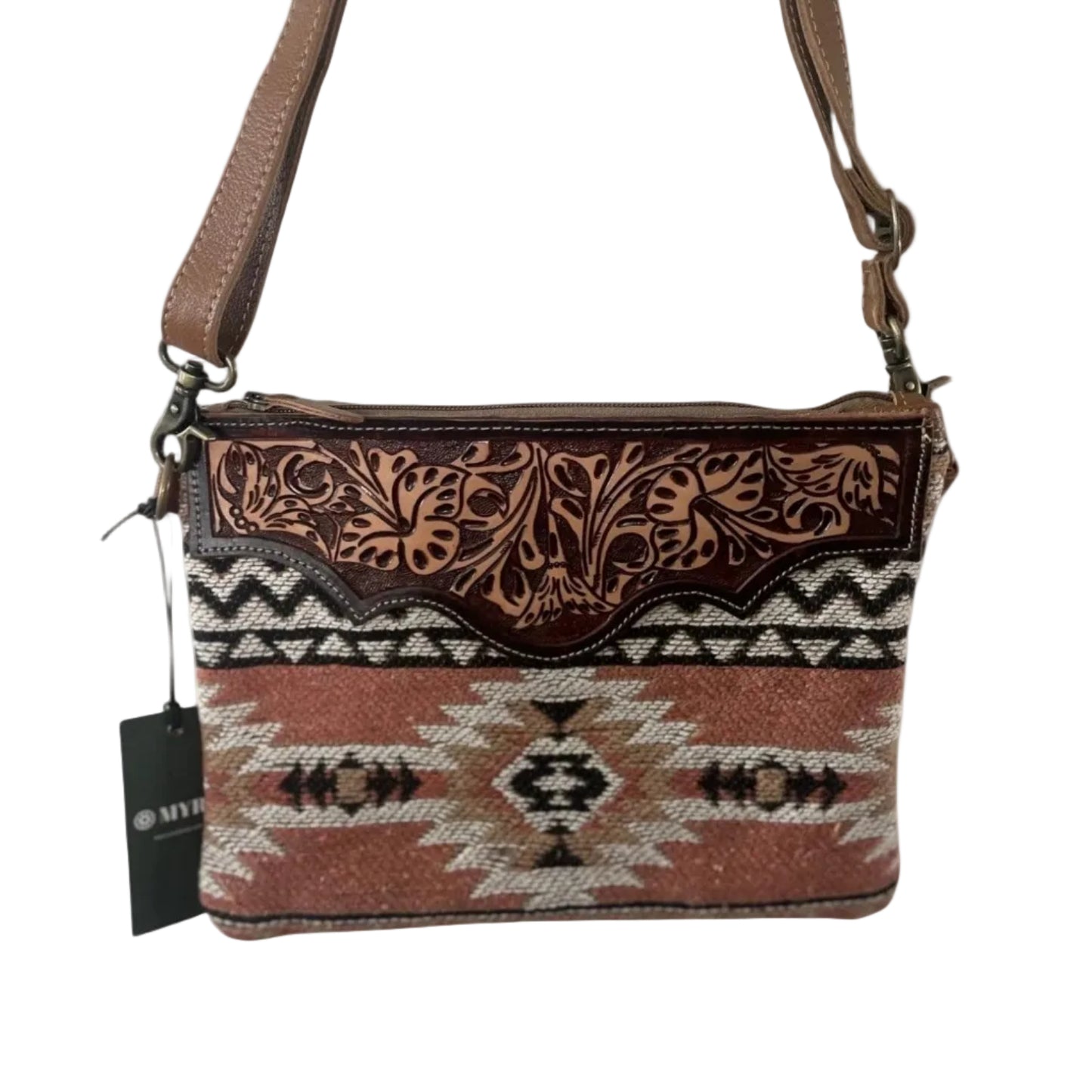 Crossbody bag with tribal pattern and brown strap on a white background