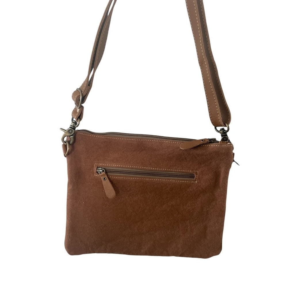 Brown leather crossbody bag on a white background
