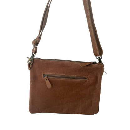 Brown leather crossbody bag on a white background