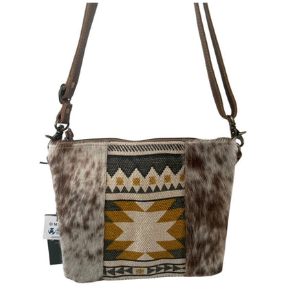 Crossbody bag with cowhide leather and geometric pattern on a white background
