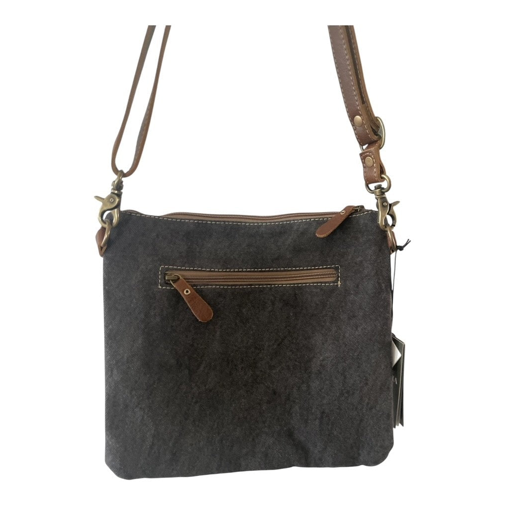 Gray crossbody bag with brown leather accents on a white background