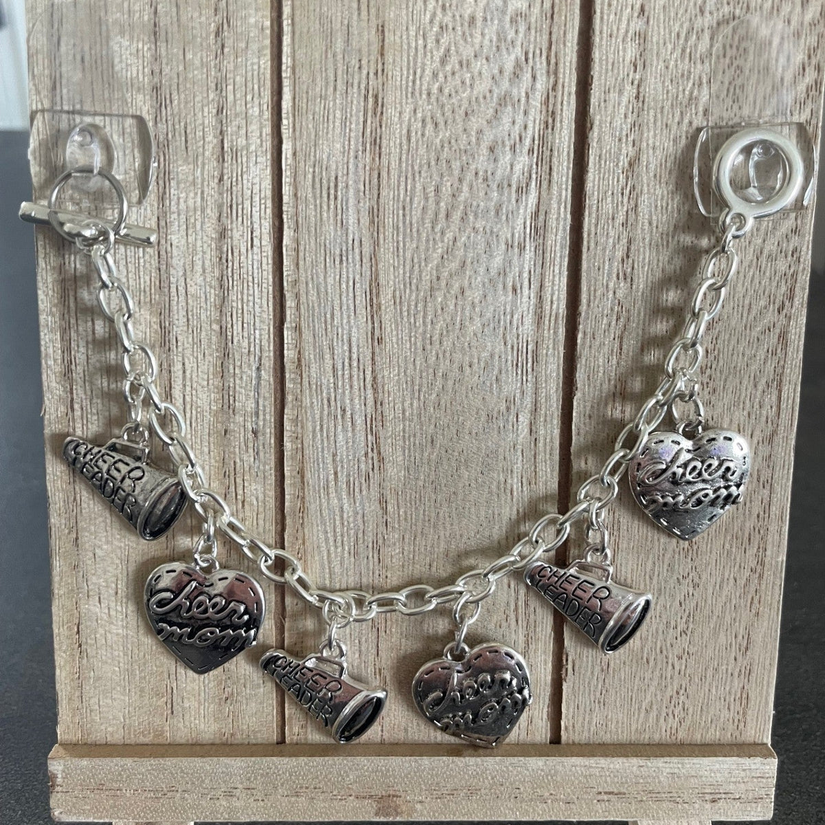 silver charms heart and cheer mom and megaphone on a silver toggle bracelet