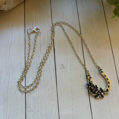 Necklace with a decorative clasp on a wooden surface