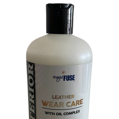 Exterior by Equifust leather wear care in a clear bottle with a black cap