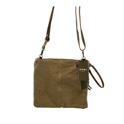 Brown leather crossbody bag with a visible brand tag on a white background