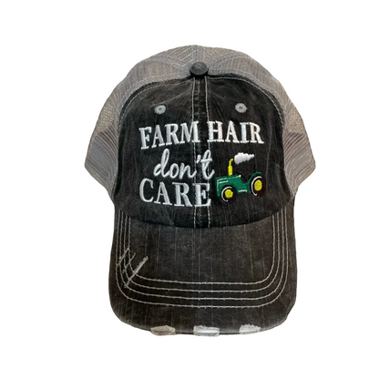 Cap with 'Farm Hair Don't Care' text and tractor graphic on a white background