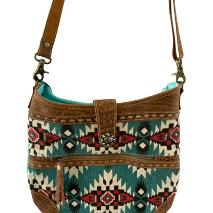 Handbag with tribal pattern and brown straps on a white background