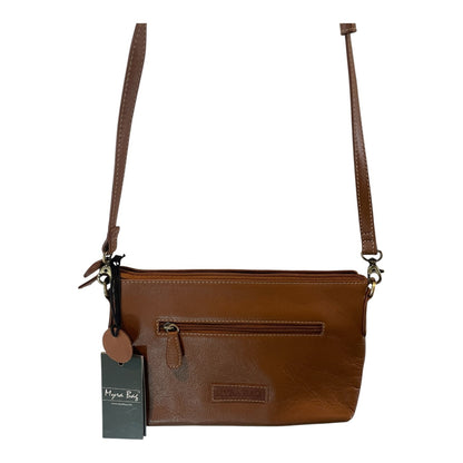 Brown leather crossbody bag with a tag on a white background