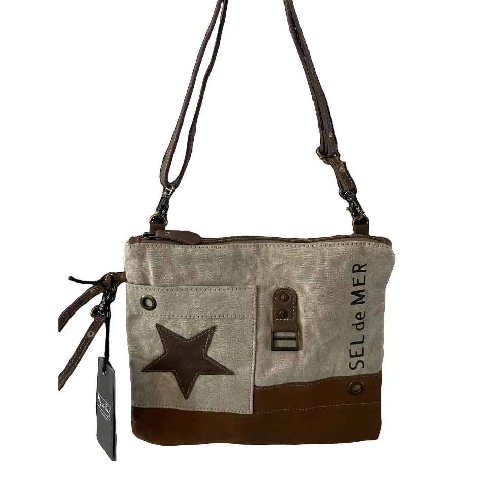 Canvas handbag with star design and 'Sel de Mer' branding on a white background