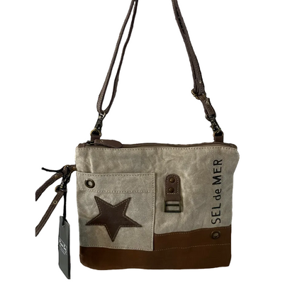 Canvas handbag with star design and 'Sel de Mer' branding on a white background