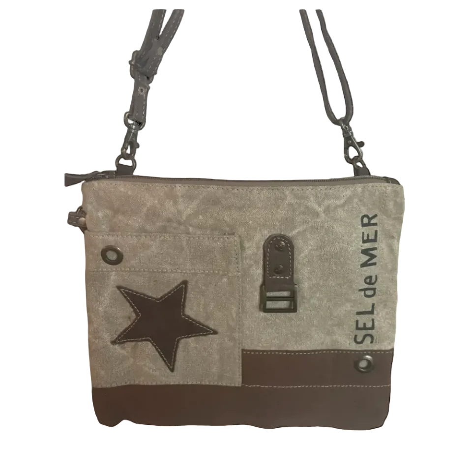 Gray crossbody bag with star design and 'Sel de Mer' branding on a white background