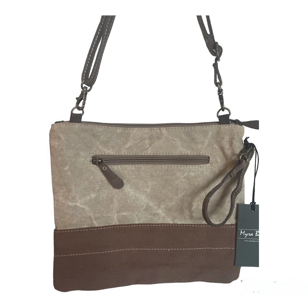 Brown and beige handbag with a visible brand tag on a white background